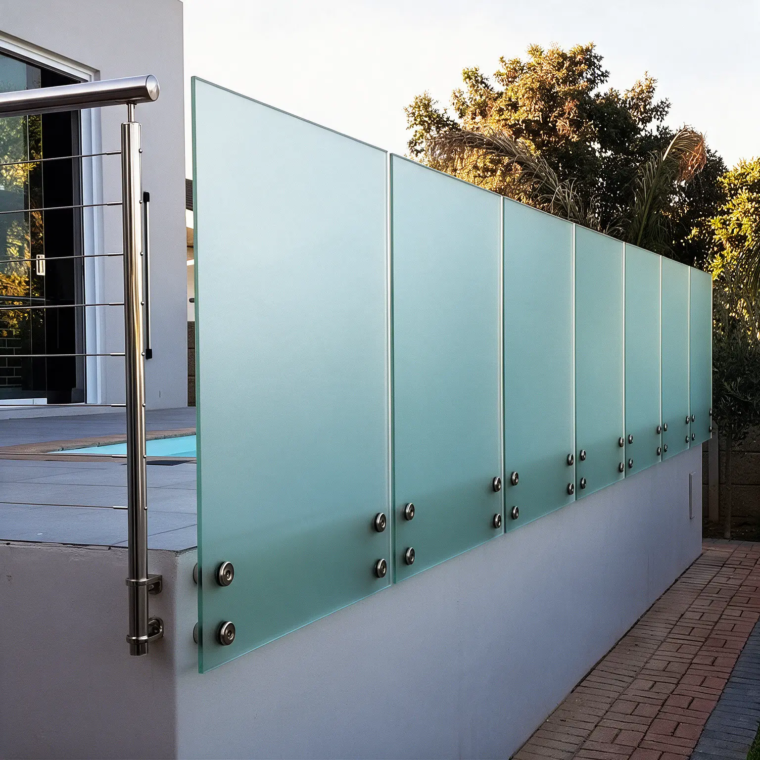 Glass stand-off balustrade in 316 polished stainless steel