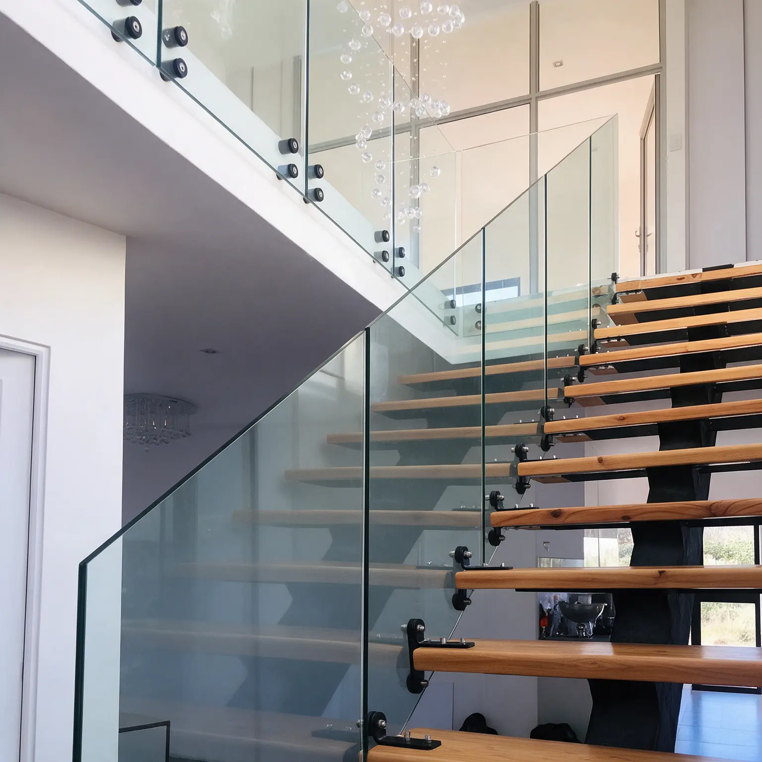 Stainless steel glass stand-off installation