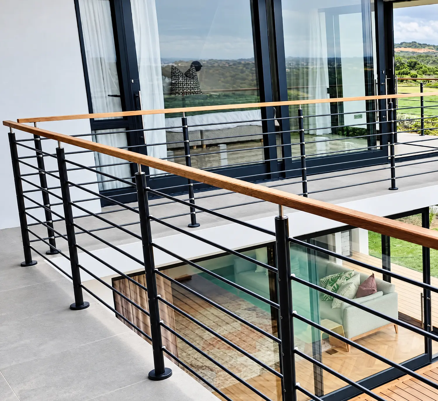 Horizontal filler bar balustrade with dark posts and timber handrail